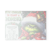 Load image into Gallery viewer, Grinch Holiday Glass Cutting Board — "Seasoned With A Touch of Grinch" Kitchen Decor
